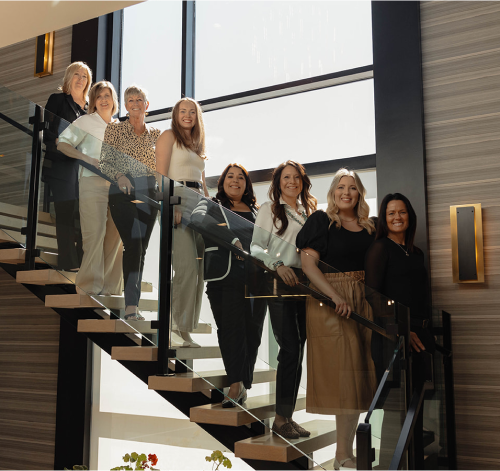 Interior Concepts Design team on the stairway in their custom office