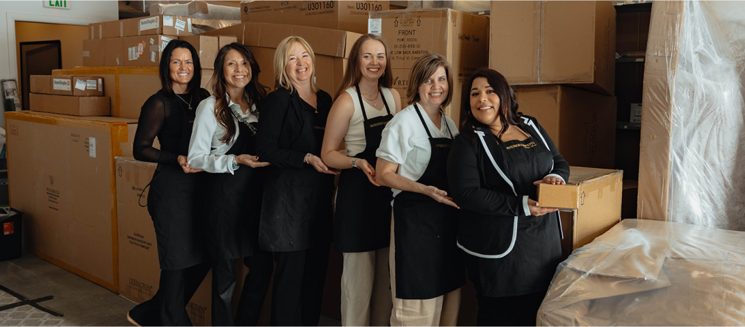 Interior Concepts Design team smiling in the warehouse